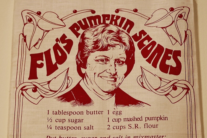 A tea towel saying Flo's pumkin scones
