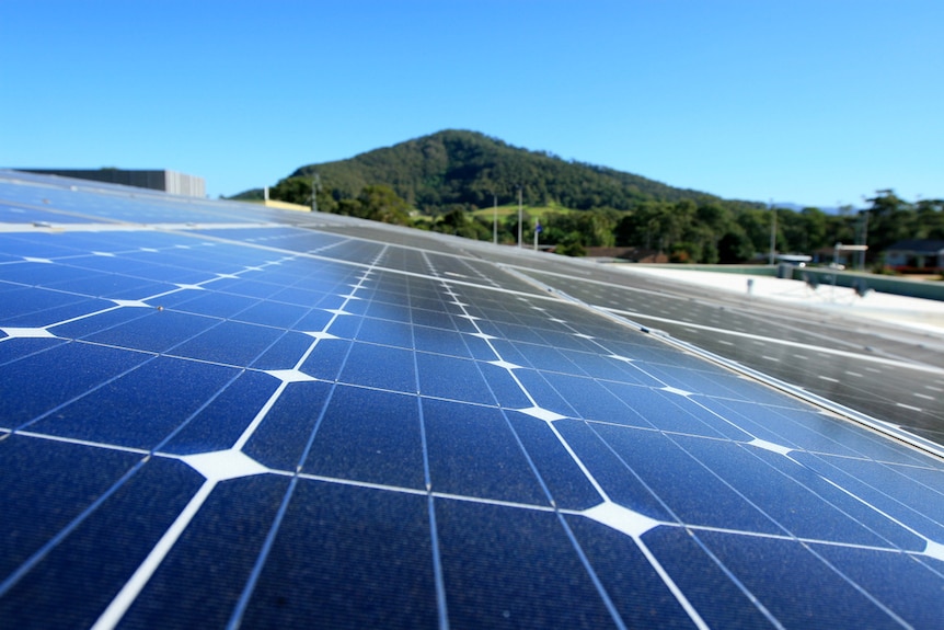 A close-up of solar panels on top of a house