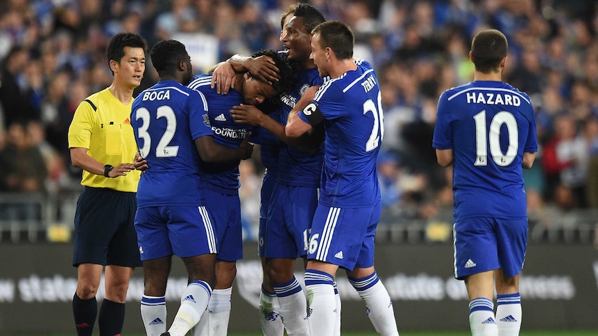 Loic Remy of Chelsea is congratulated by team mates after scoring a goal against Sydney FC