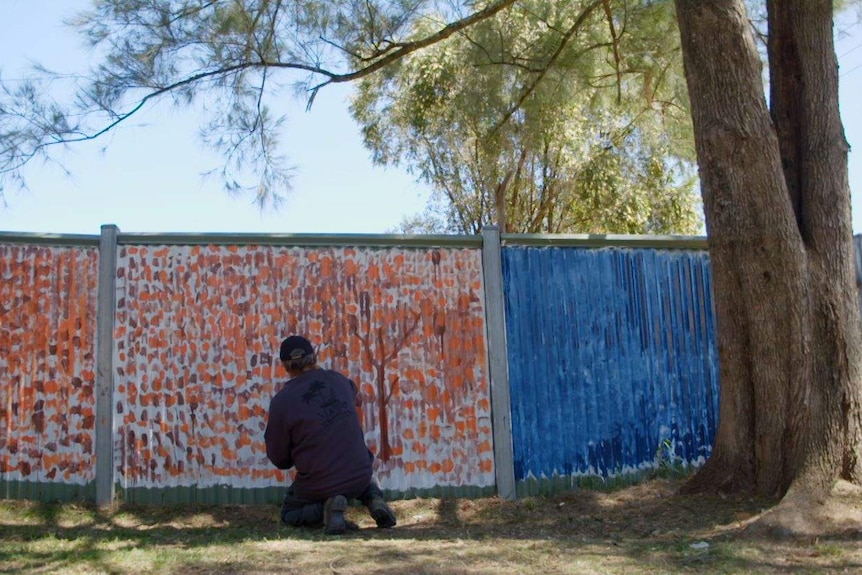 A mural on the fence at the local Aboriginal Land Council.