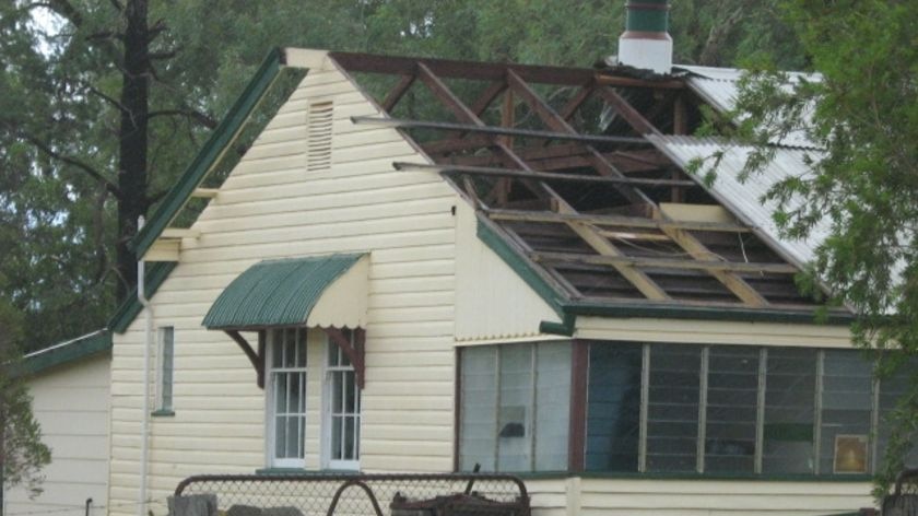 Winds of up to 130kph tore through St George in the state's south-west, taking the roofs off houses.