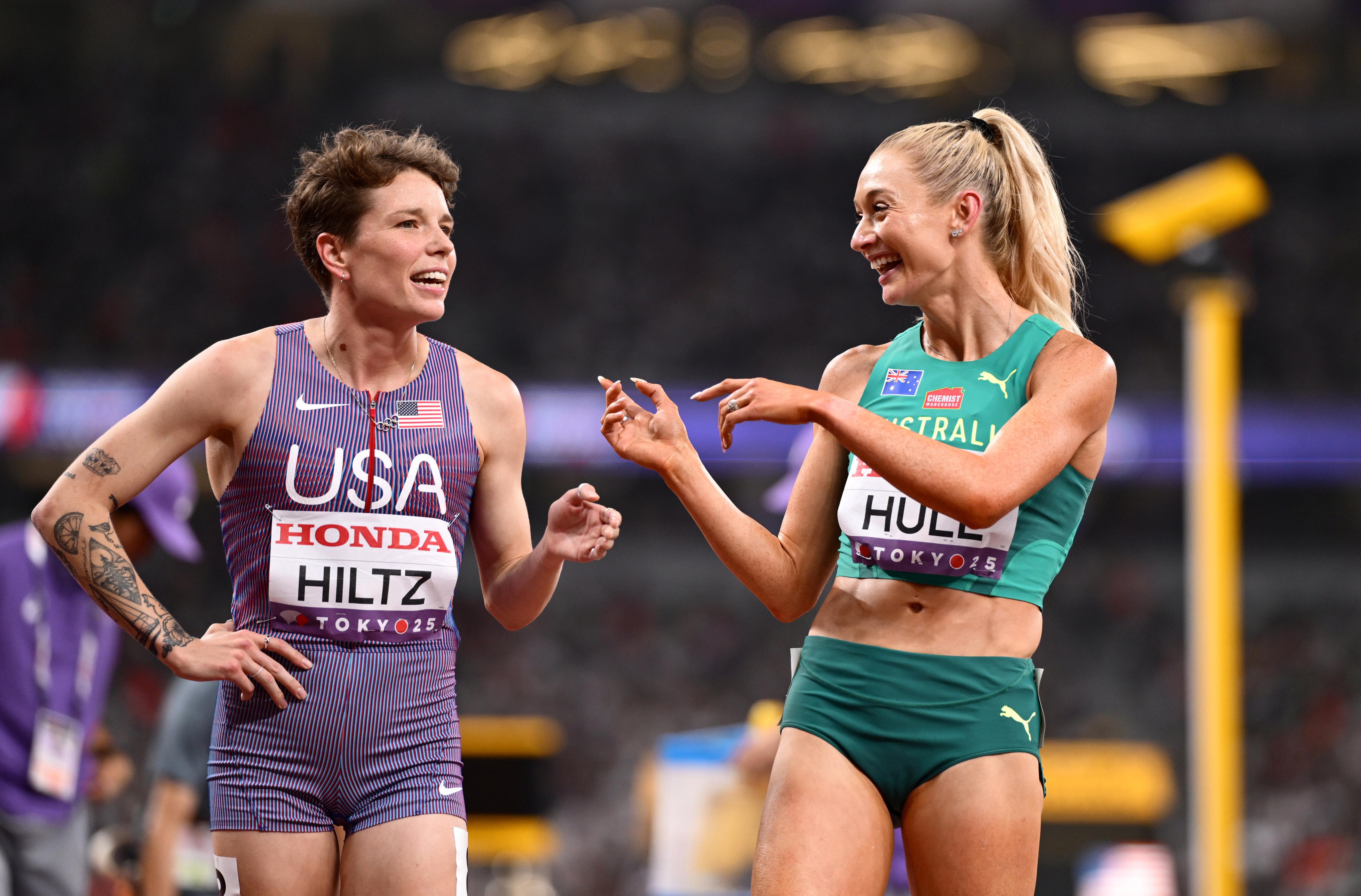 Jess Hull points at Nikki Hiltz