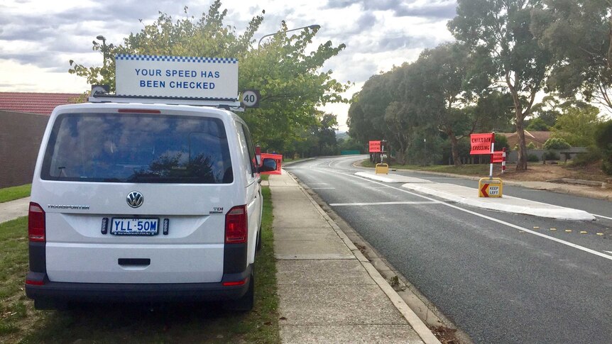 A mobile speed van in front of a crossing at a school in Canberra.