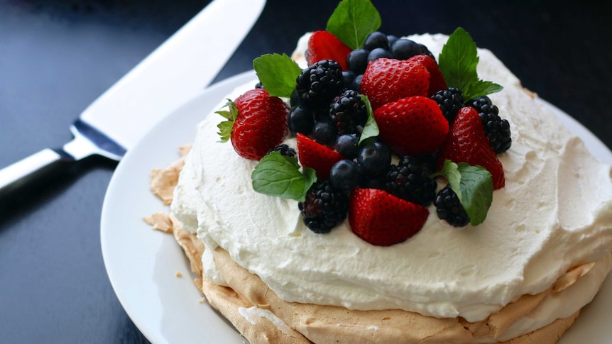 Pavlova with fruit and cream