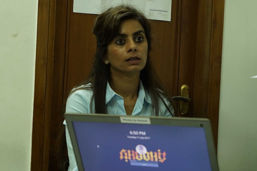 Software Freedom Law Centre of India co-founder Mishi Choudhary sits a a desk and stares ahead