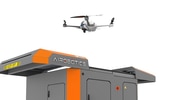 Picture of autonomous drone coming out of top of docking station that is 2.5 metres square