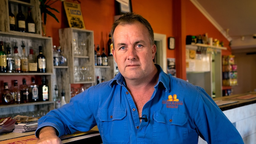 Devils Marbles Hotel co-owner Greg Targett stands by the bar.