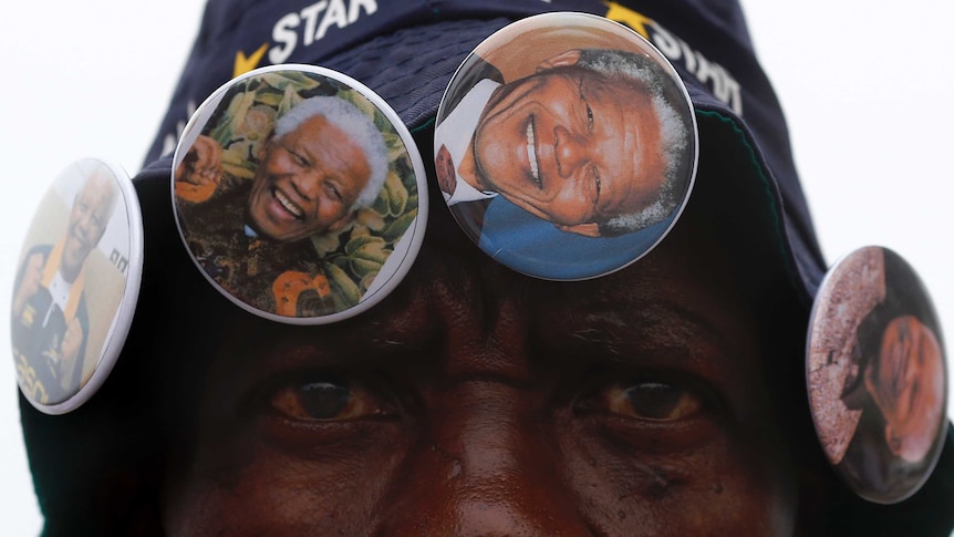 Street vendor with Mandela pins