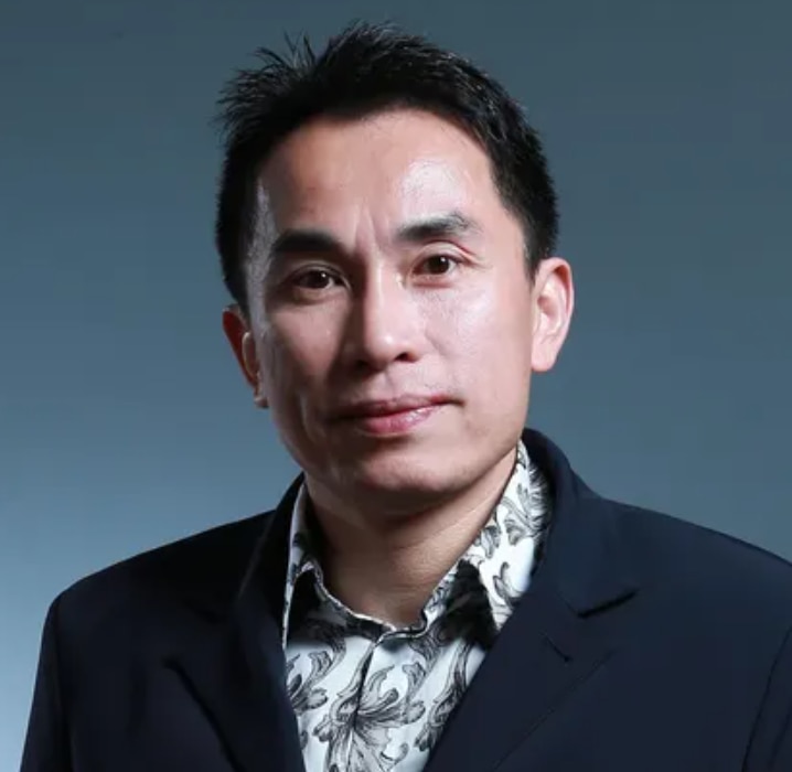 a close up headshot of chinese billionaire gordon tang