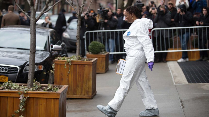 NYPD crime scene investigator comes out from Hoffman's apartment