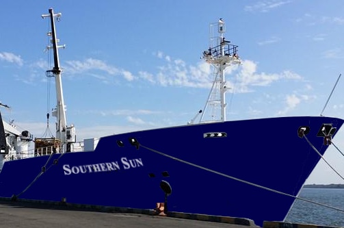 A blue ship in a port.