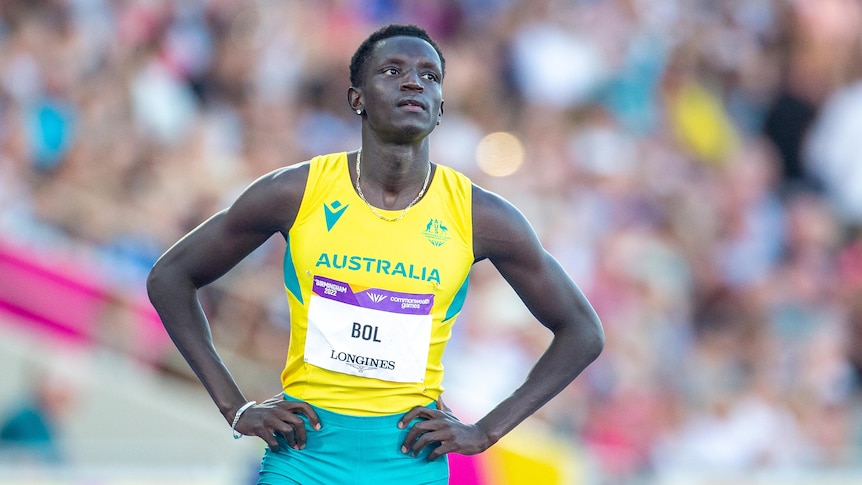 Peter Bol stands with his hands by his side