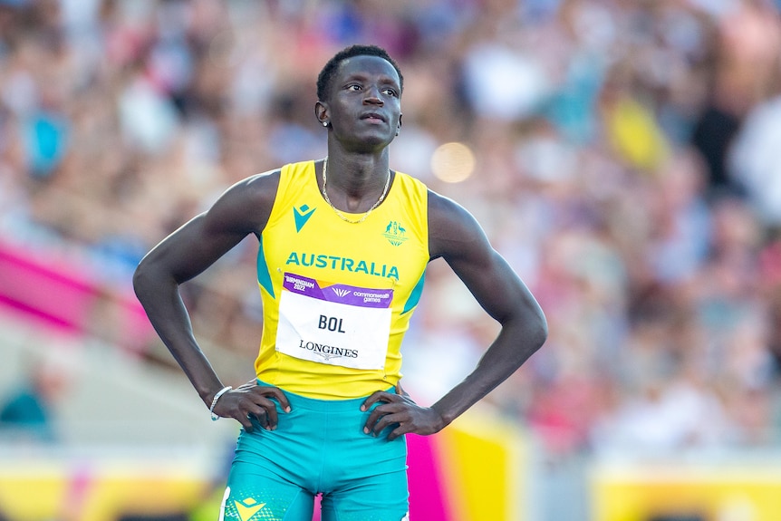 Peter Bol stands with his hands by his side