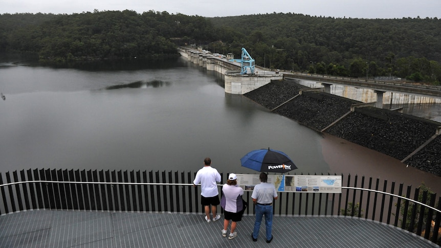 Spectators watch Warragamba Dam overflow