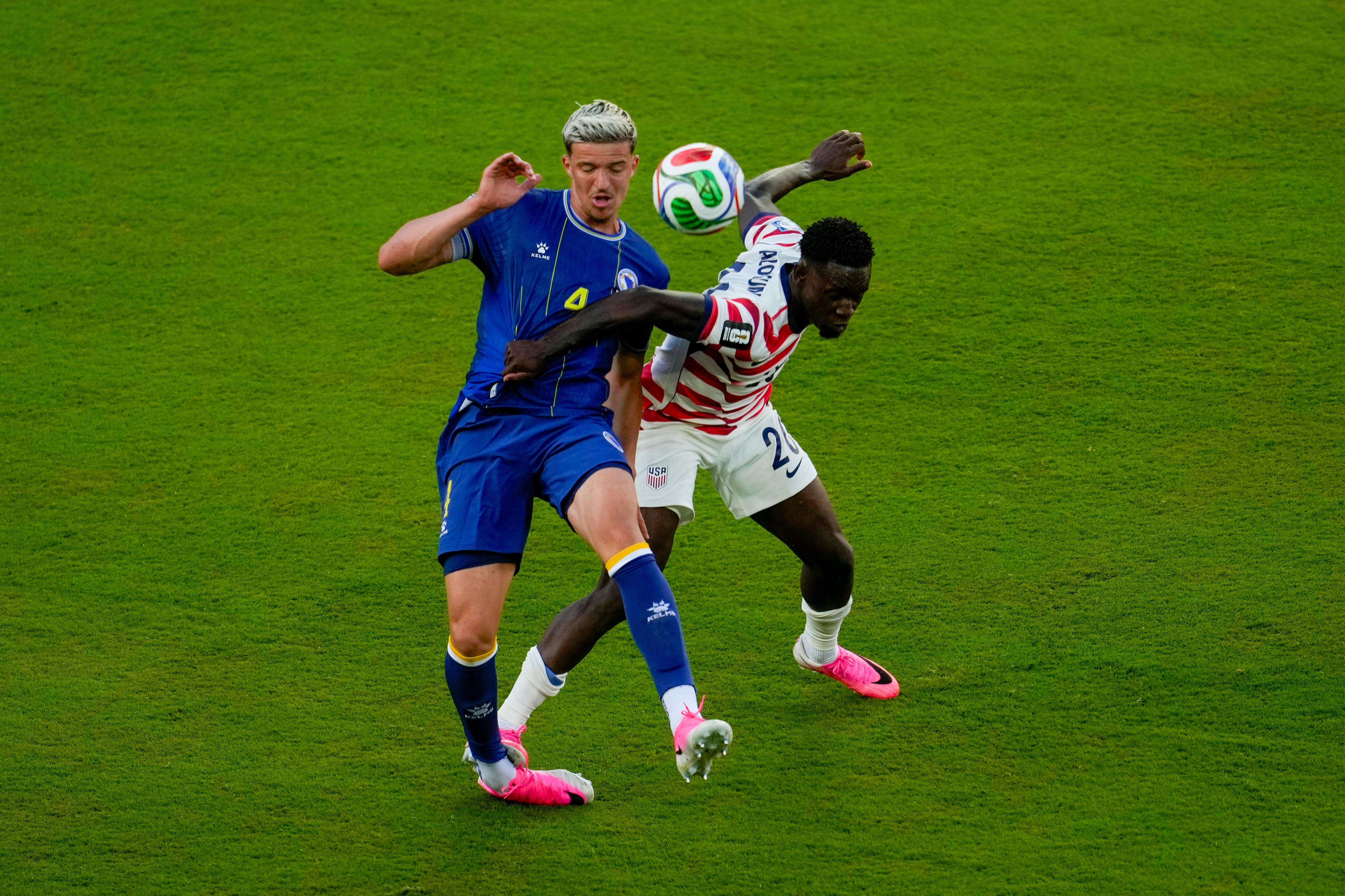 Folarin Balogun's foot rests on Tarik Muharemović's ankle.