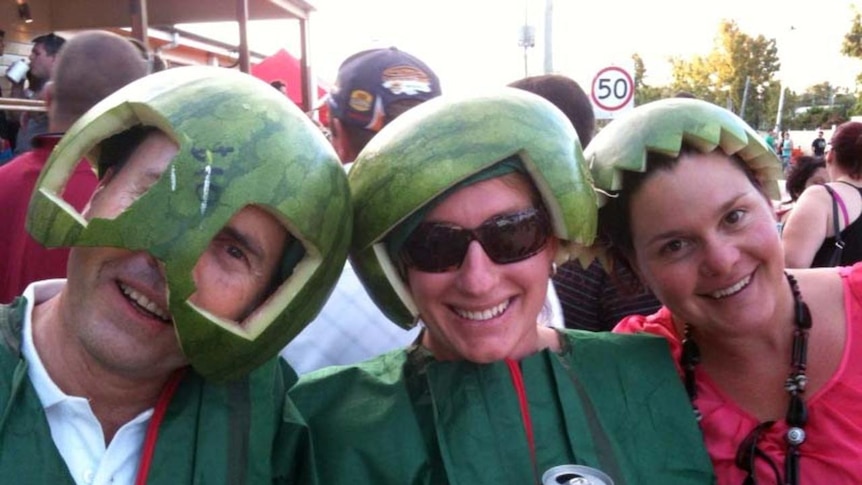 Festival goers wear watermelon helmets at the Melon Festival in Chinchilla on February 18, 2011.