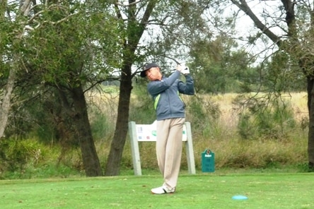 Ben Norris playing golf