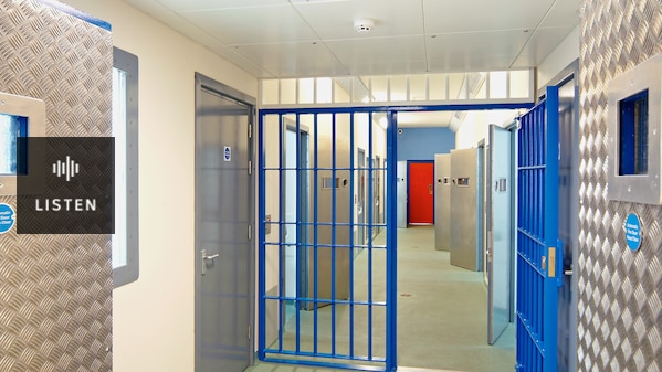 Inside of a modern prison with open doors. Has Audio.