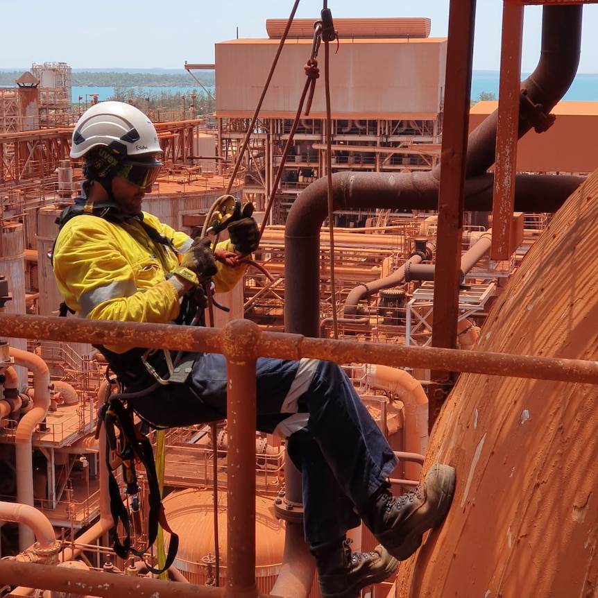 A miner is working on the decommissioned Gove refinery.