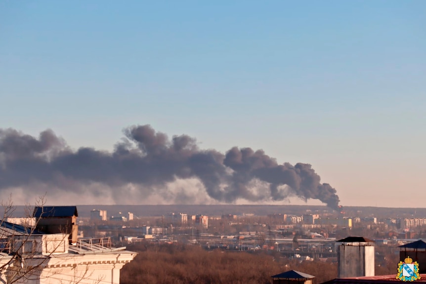 Smoke rising out of city scape