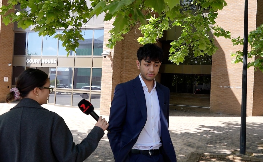 A man in a suit outside court