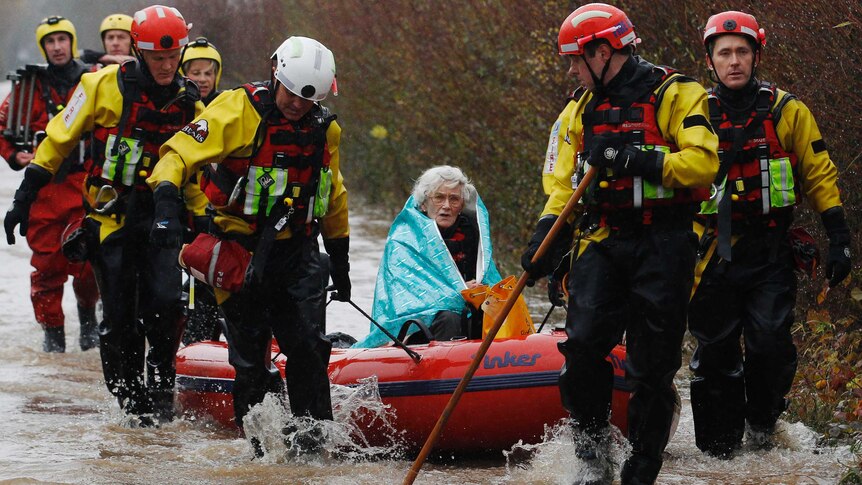 Diana Mallows, 90, is rescued by the Devon and Somerset Fire and Rescue Service.
