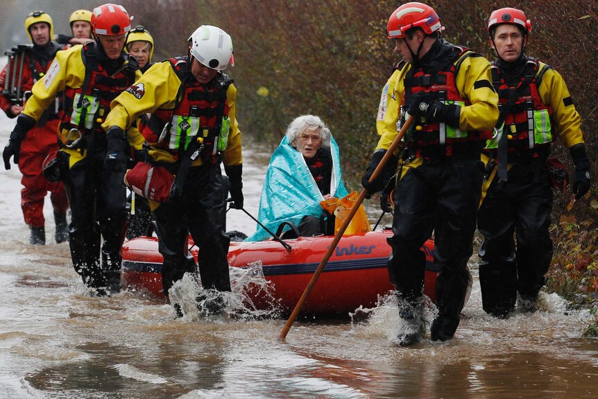 Diana Mallows, 90, is rescued by the Devon and Somerset Fire and Rescue Service.