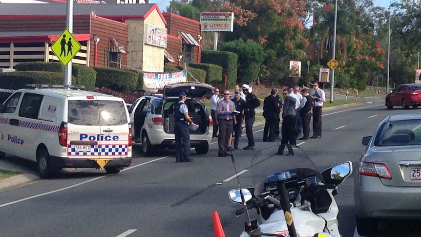 Police at scene of shooting at a tavern at Highland Park, south-west of Carrara