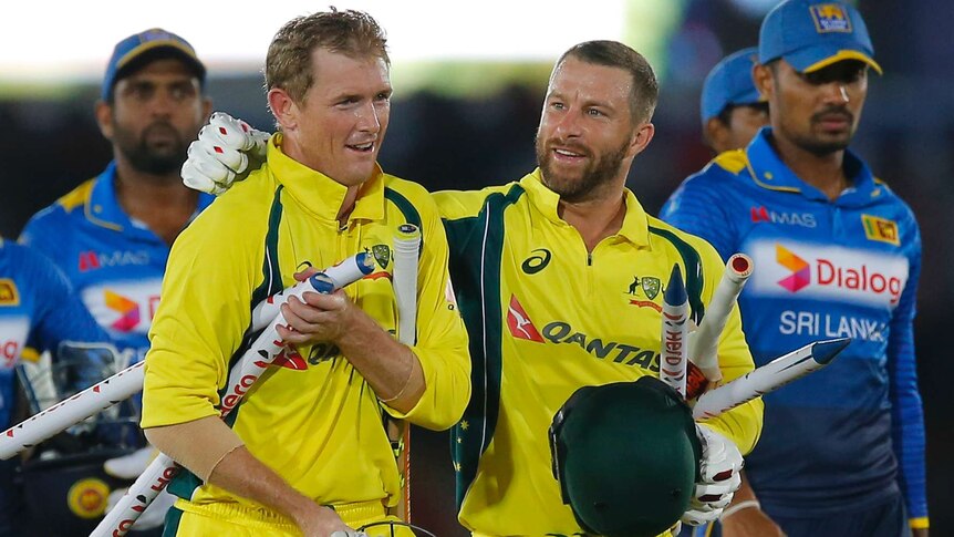 Australia's George Bailey (L) and Matthew Wade celebrate ODI win over Sri Lanka in Dambulla.