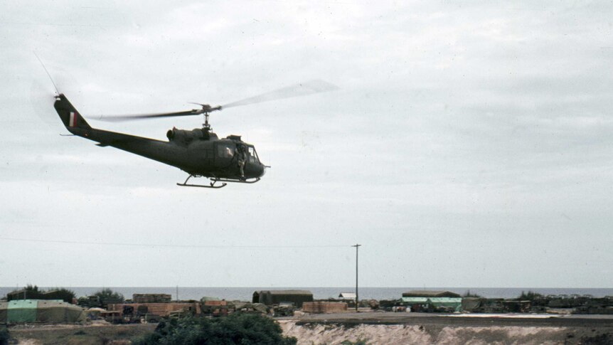 An Iroquois helicopter prepares to land at the 1ALSG base.