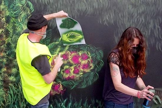 Painters working on the Save The Tassie Devil street art project.