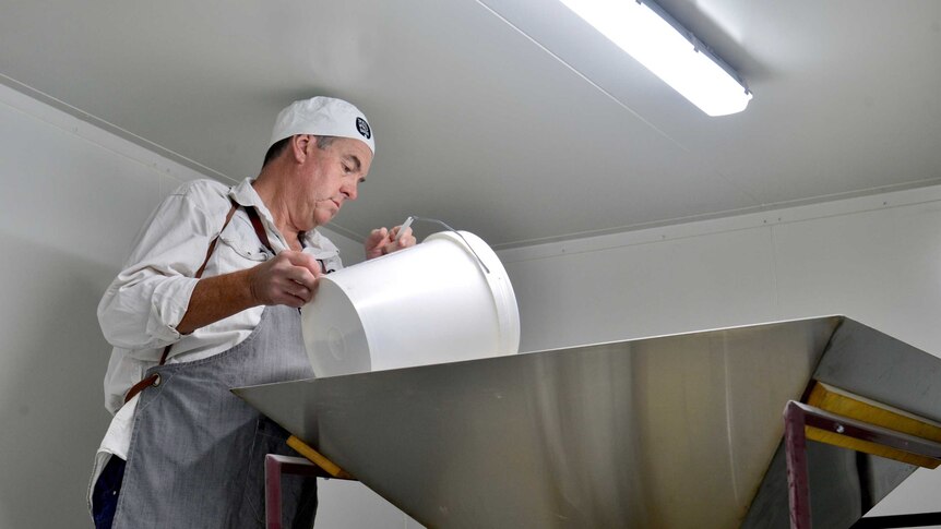 Chris Duffy grinding flour