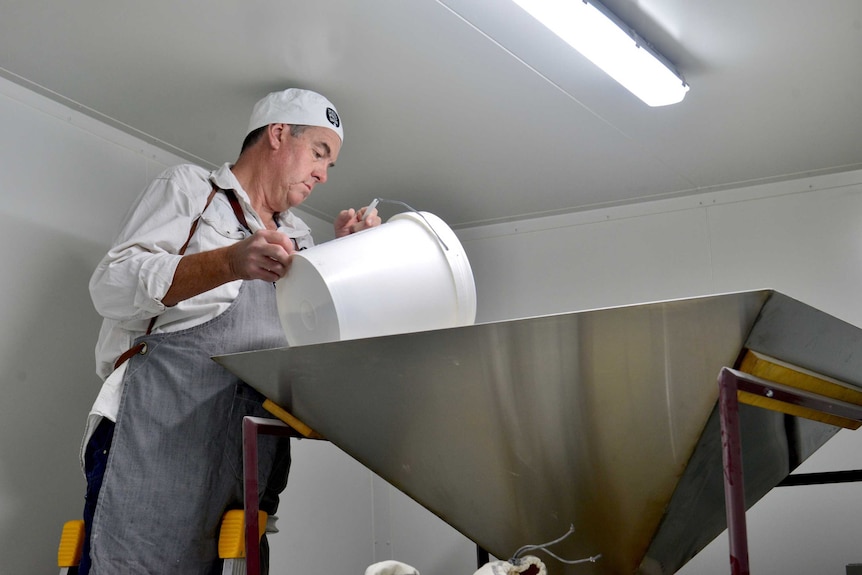 Chris Duffy grinding flour