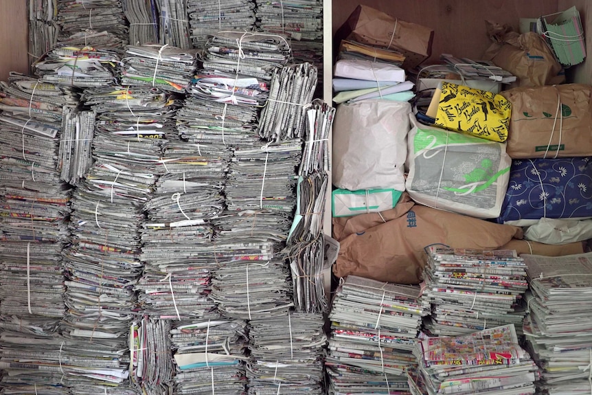 Stacks of newspapers at Kamikatsu recycling plant