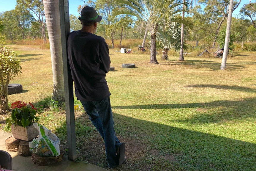 David Cook stands in his backyard lookout out at the view.