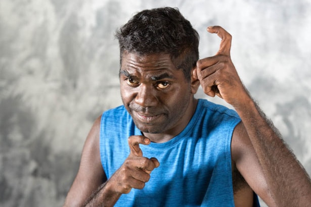 A Yolngu man doing signs.