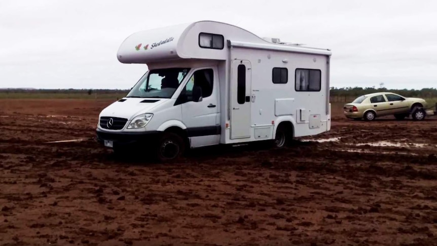 A stranded camper van on a tow line