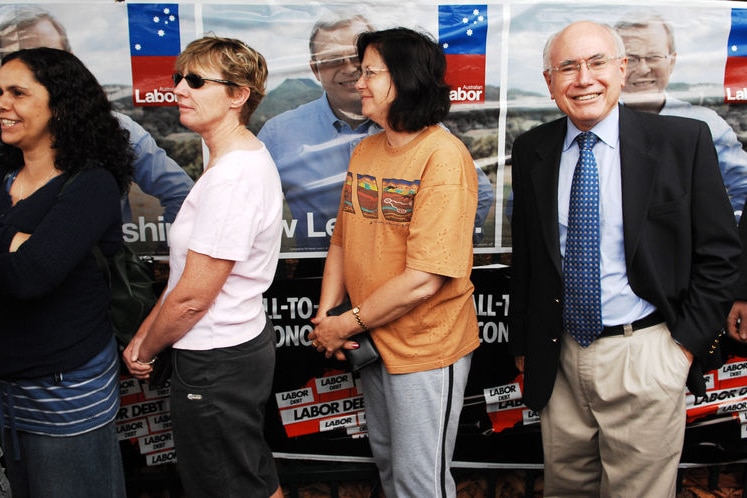 Prime Minister John Howard waits in line to cast his vote at Ermington Primary School in Sydney on Saturday, November 24, 2007.