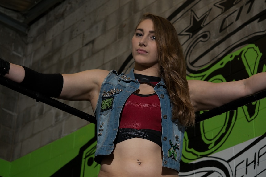 Demi Bennett waits in her wrestling ring corner.