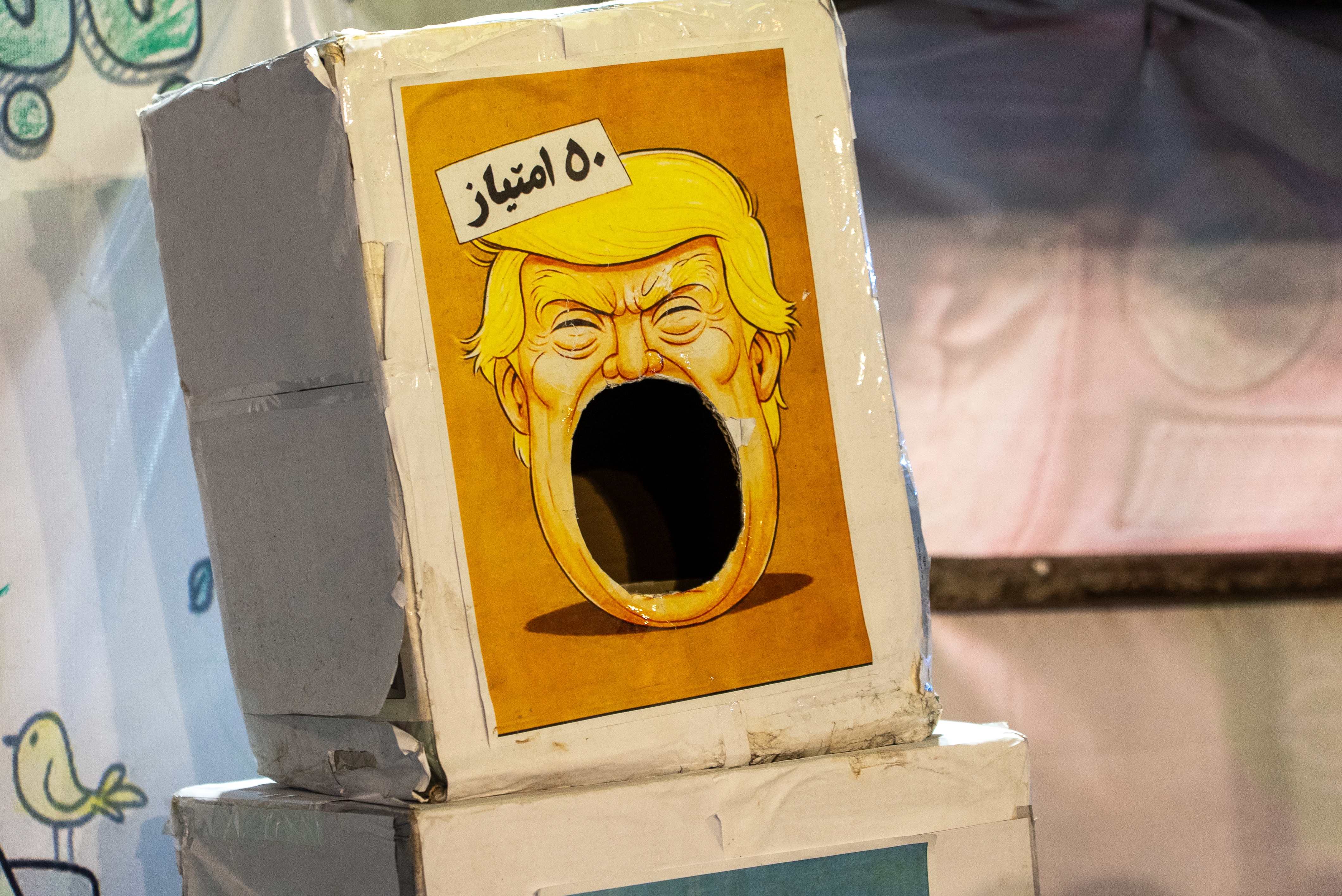A caricature of Donald Trump's face on a box. 