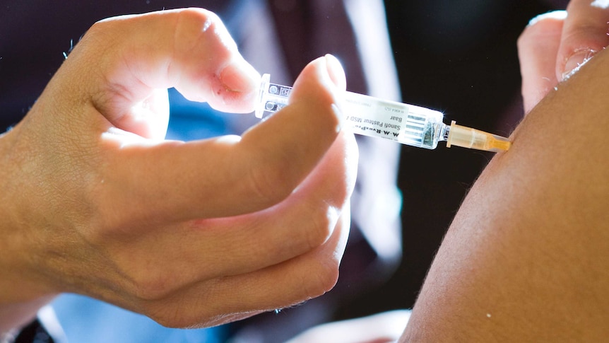 A student receives a measles vaccine injection at the Ecole Polytechnique Federale de Lausanne (EPFL).