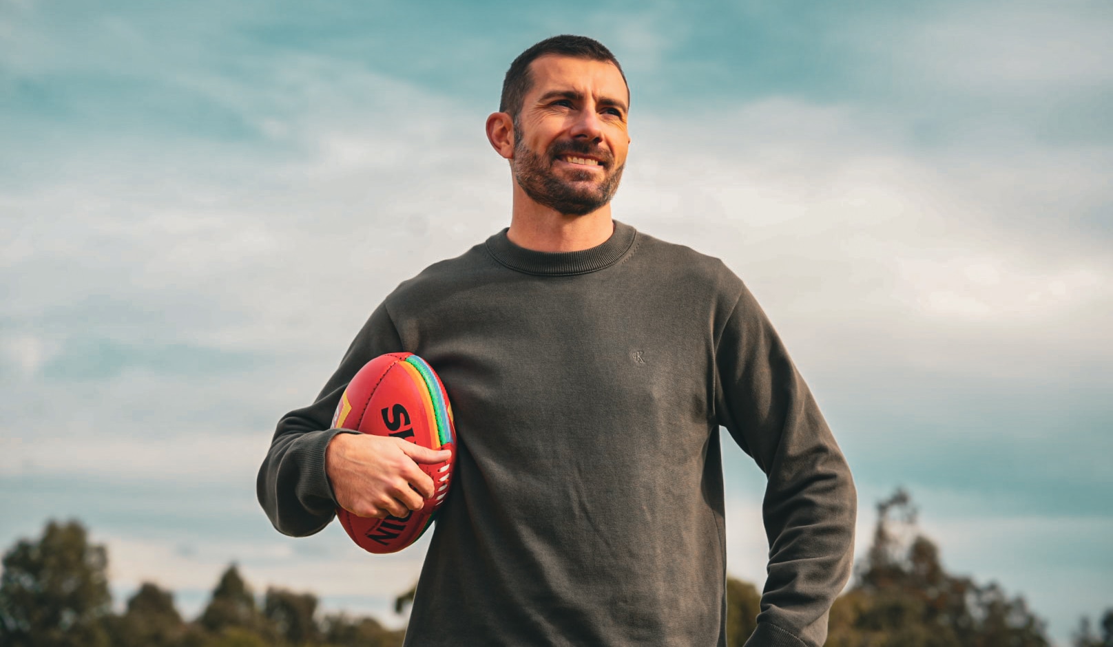 AFL’s first publicly gay player calls for respect in Crows-Pies match