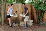 Pair pick up pavers in a backyard.