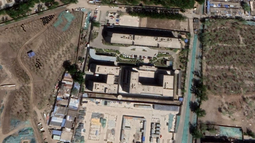 A satellite image of a large building and car park 
