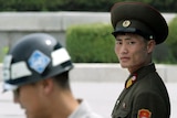 South and North Korean soldiers stand guard in the demilitarised zone