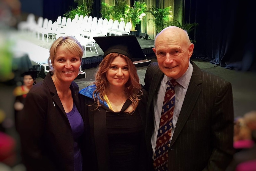 Detective Natalie Bennett and crown prosecutor Ron Swanwick with Shelly Braieoux (centre)