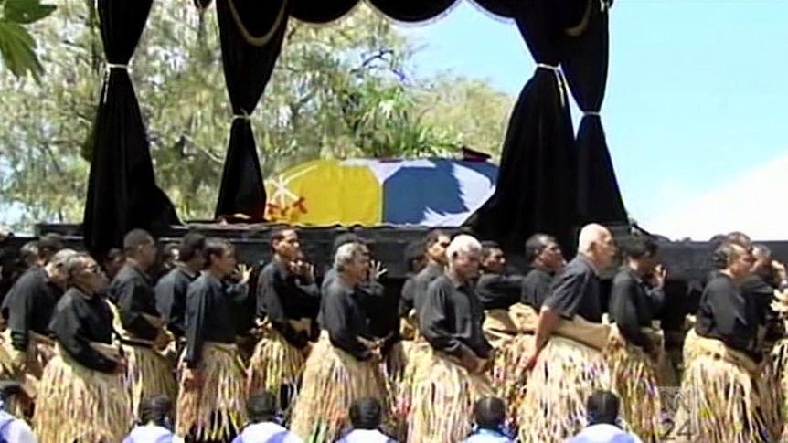 The coffin of Tonga's late King George Tupou V is carried from the palace.