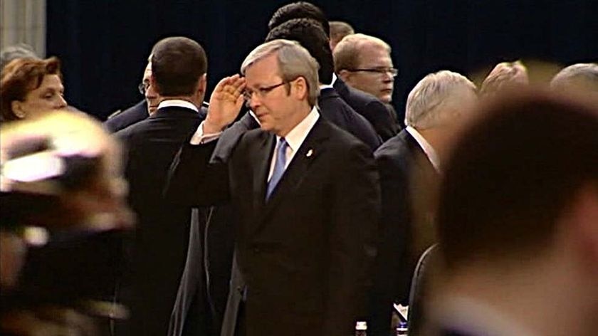 Prime Minister Kevin Rudd salutes US President George W Bush.