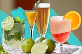 Collection of low-alcohol cocktail recipes on a table, including mojito mocktail, mimosa, low-alcohol beer and Aperol float