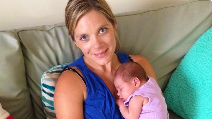 Tara Costigan holding her baby daughter.